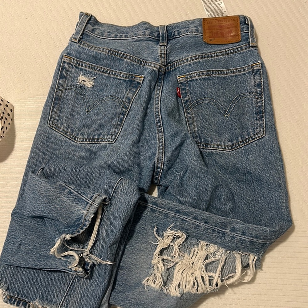 levi’s medium to light wash distressed mom jeans